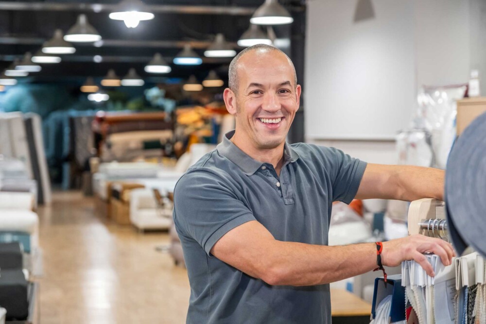 man in business casual shirt smiling